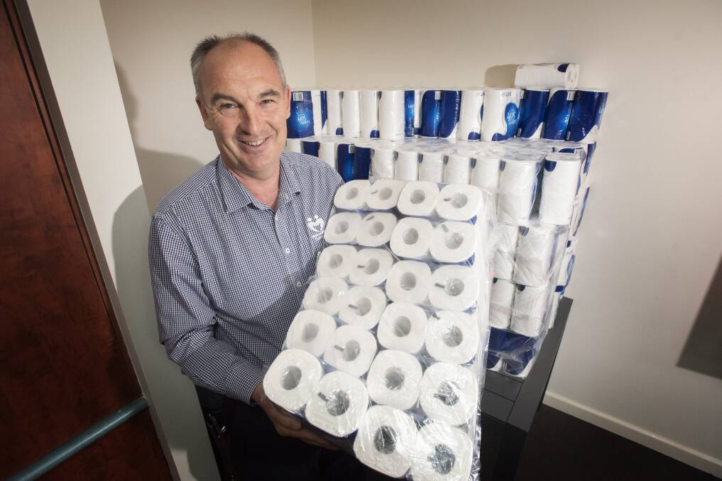 HOT COMMODITY: Peter Gallagher with the supply for clients. Photo: Peter Hardin 