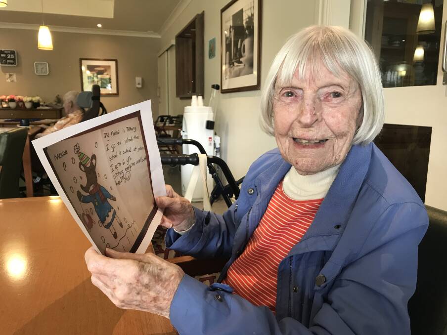 PEN PALS: Bupa Aged Care Tamworth resident Joy Hennessey with a drawing she received from six-year-old Tiffany. Photo: Supplied