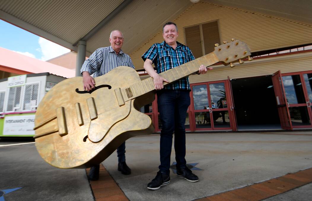 TUNING IN: Tamworth Regional Council's Barry Harley and Peter Ross at the TRECC, where the Golden Guitar Awards are being set up. Photo: Gareth Gardner