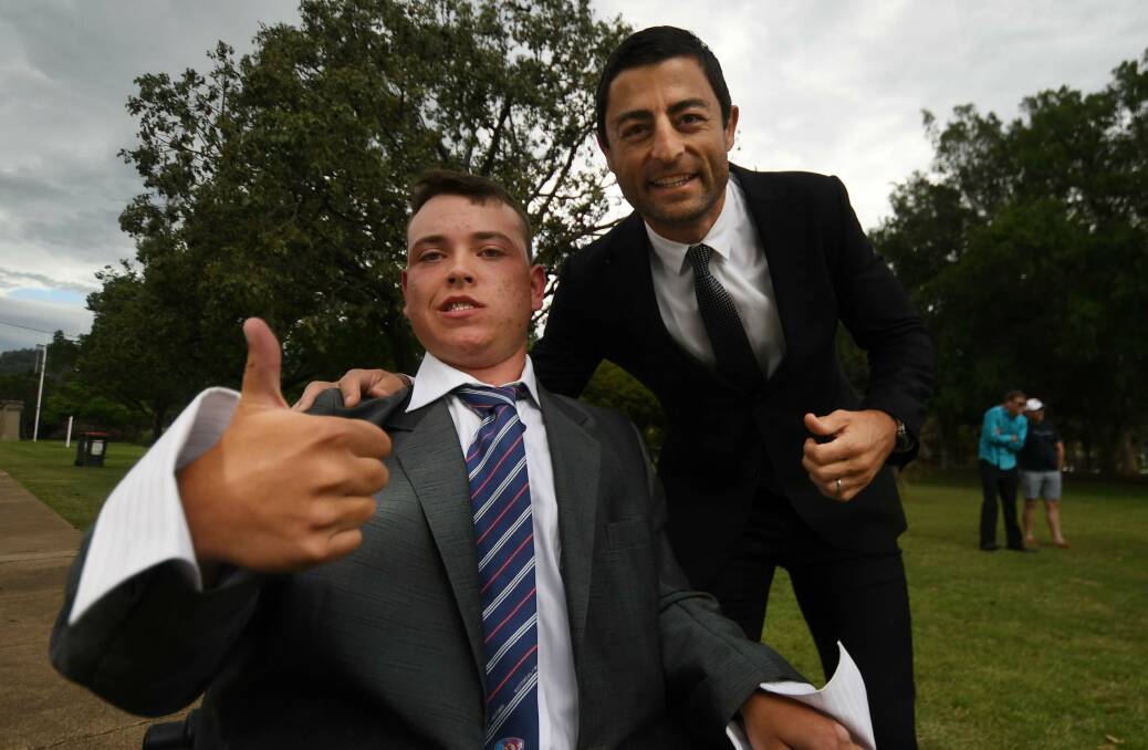 BEST BUDS: Tamworth teenager Joel Kiddle and footy legend Anthony Minichiello all suited up for Joel's high school graduation. Photo: Gareth Gardner