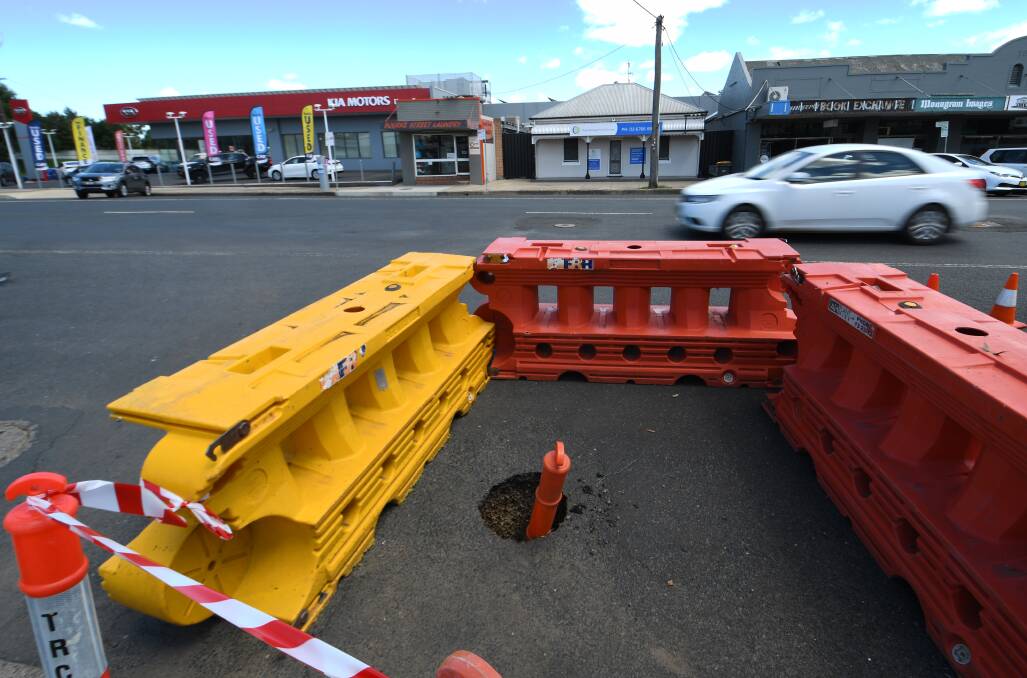 BLOCKED OFF: A small sinkhole has opened up on Bourke Street and council has plans to fix it up soon. Photo: Gareth Gardner