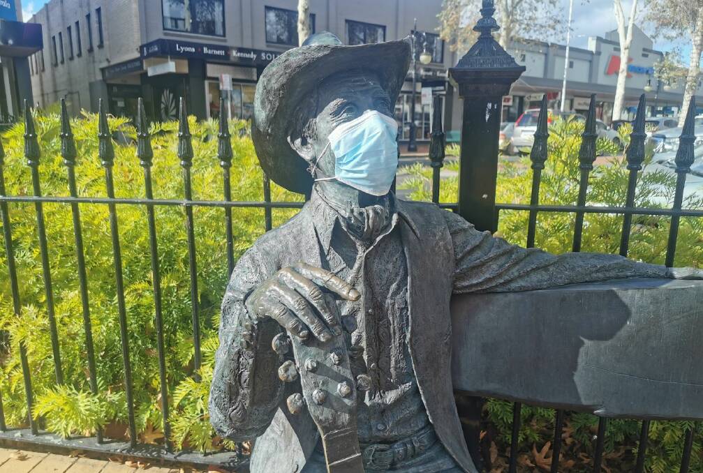 STAY SAFE: Smoky Dawson masks up on Peel Street in Tamworth. Photo: Gareth Gardner