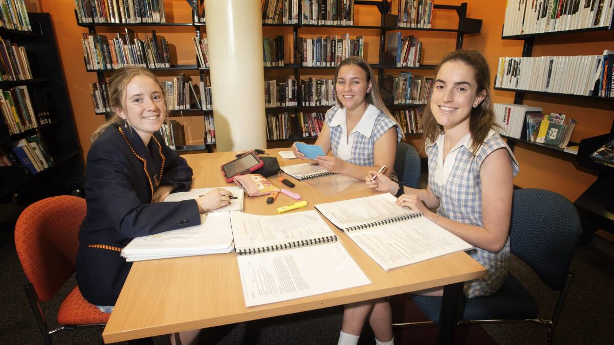 TEAMWORK: Oxley High School students Olivia Collison, Annie Walker and Abbey Prout are about to start their final high school exams. Photo: Peter Hardin