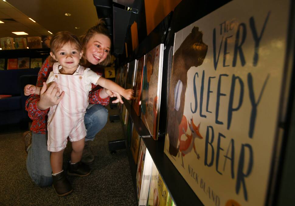 READING ROCKS: Ashleigh Dallas and her daughter Harriet look forward to getting a book in the mail each month as part of Dolly's Imagination Library program. Photo: Gareth Gardner