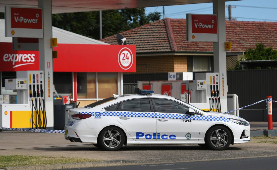 CRIME SCENE: A man was found with stab wounds at a Tamworth petrol station, and police combed the scene. Photo: Gareth Gardner
