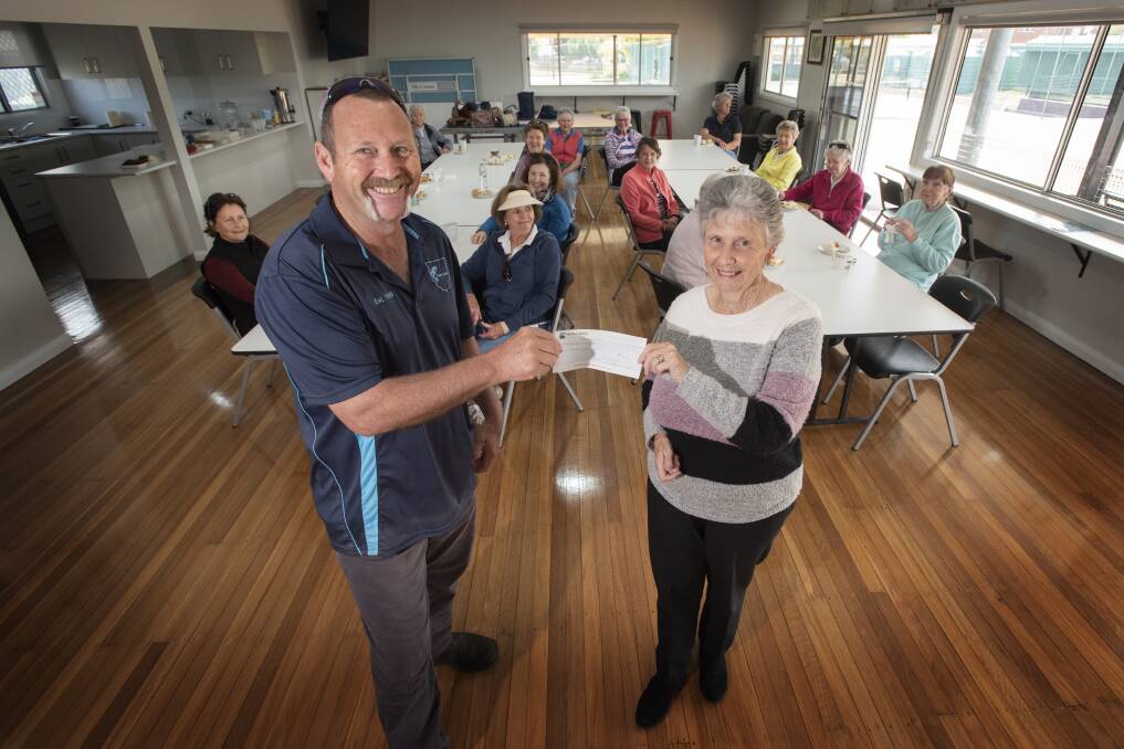 COMMUNITY SPIRIT: Yvonne Fisher presented West Tamworth Tennis Club president Brian Brooking with a donation to go towards renovations at the clubhouse. Photo: Peter Hardin 120820PHA011