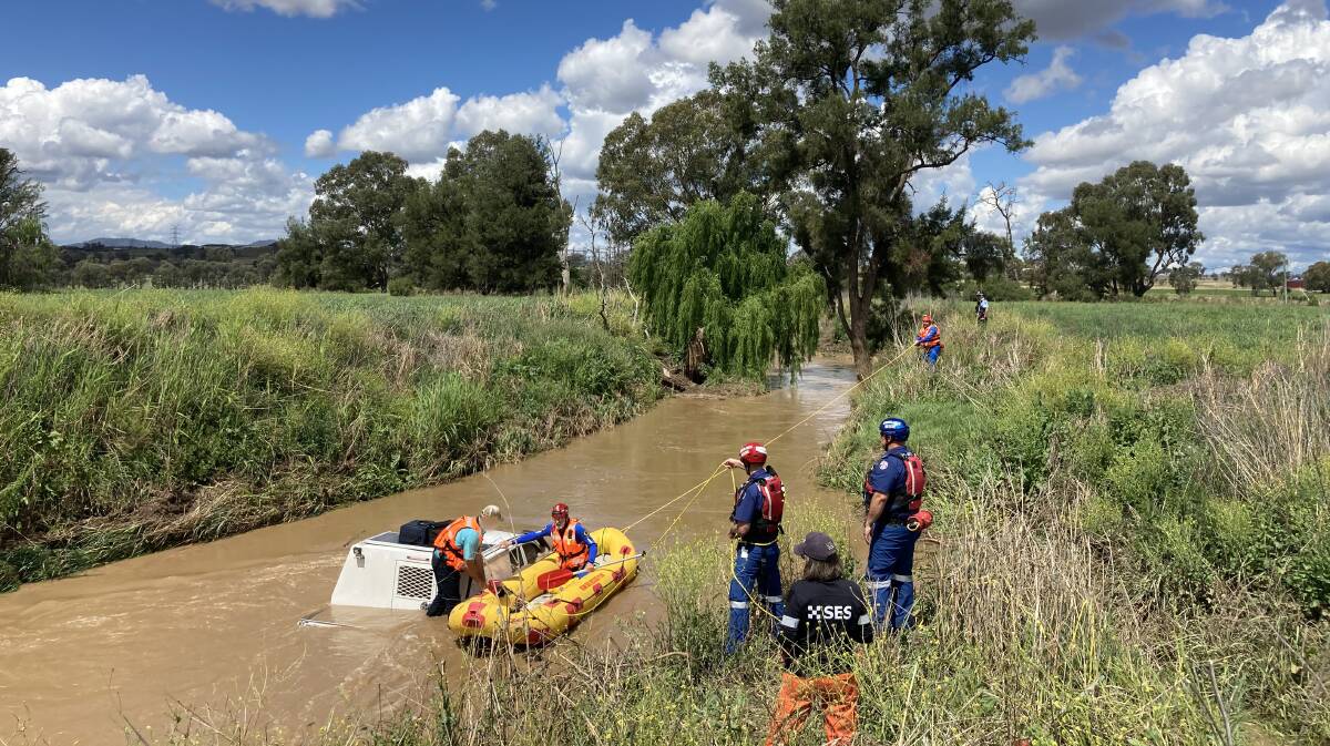 LUCKY ESCAPE: A man has been rescued from Goonoo Goonoo Creek after he tried to drive through floodwaters. Photo: SES
