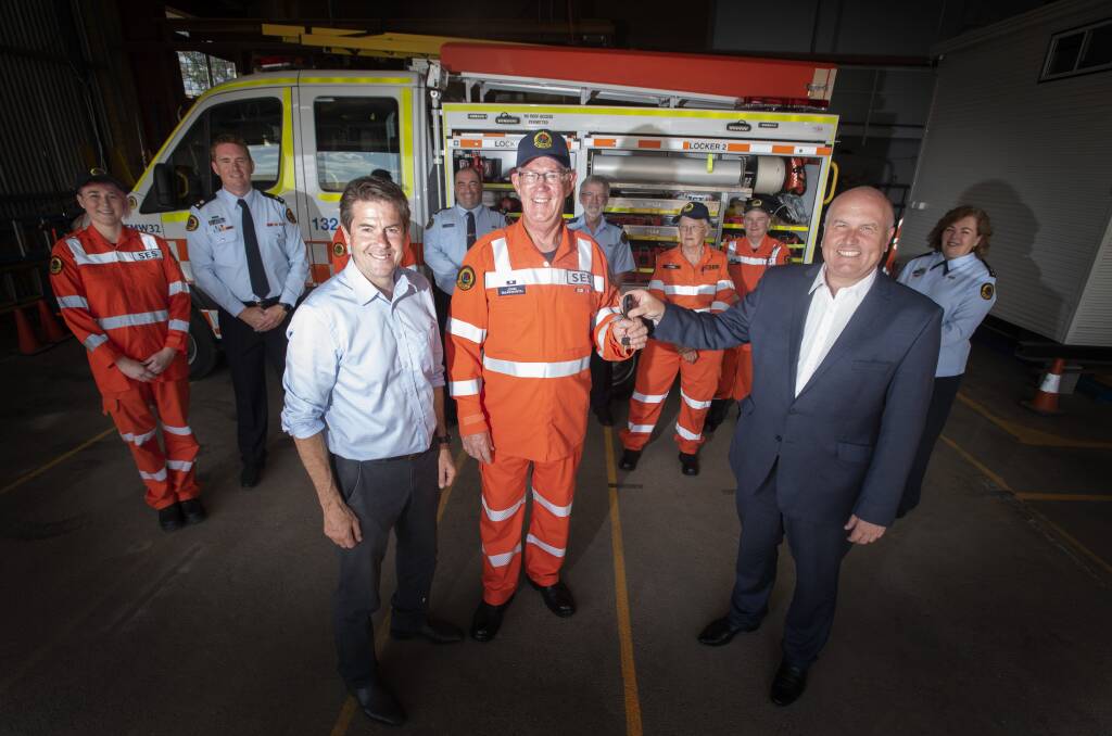 NEW TOY: Emergency Services Minister David Elliott popped in to the Tamworth SES unit to hand over the keys to a flash new storm truck. Photo: Peter Hardin