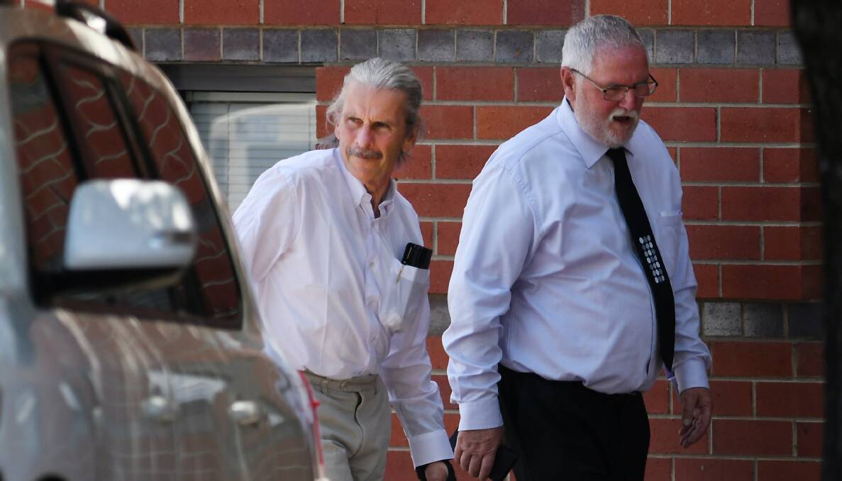 'SORRY': Dangerous driving accused Chris McKinney with a friend outside Tamworth District Court, where his trial has wrapped up after three days. Photo: Gareth Gardner