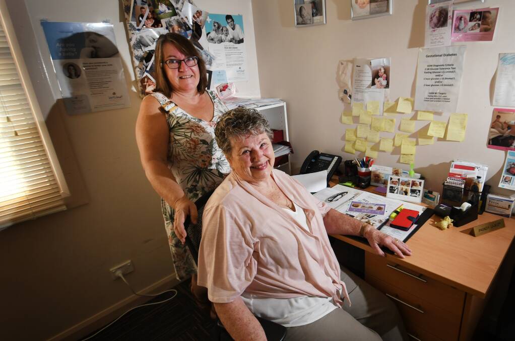 HAPPY PLACE: Practice manager Lynn Rose with retiring midwife Rhonda Lawler at her rooms in Dr Ken Apen's Tamworth clinic. Photo: Gareth Gardner