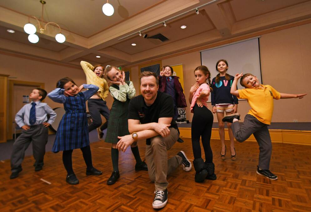 CLASS TIME: O'Grady Drama School principal Ben Mettam with the kids from one of his drama classes, which are now back face to face after the coronavirus shutdown. Photo: Gareth Gardner 