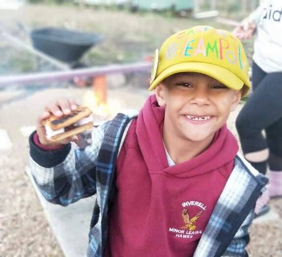 CAMP IN: Six-year-old Noah Vea practiced making s'mores for the weekend, when he will camp at home with friends and family for Camp Quality's Camp In. Photo: Supplied