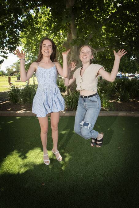 HAPPY CAMPERS: Oxley High School students Abbey Prout and Olivia Collison are looking to the future now that high school is over with. Photo: Peter Hardin
