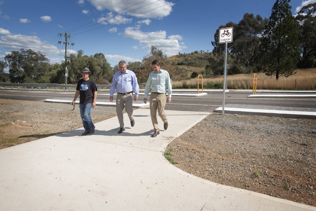CROSS WITH CARE: Jeff Benson, Col Murray and Kevin Anderson check out the new road crossing near the mountain bike park. Photo: Peter Hardin
