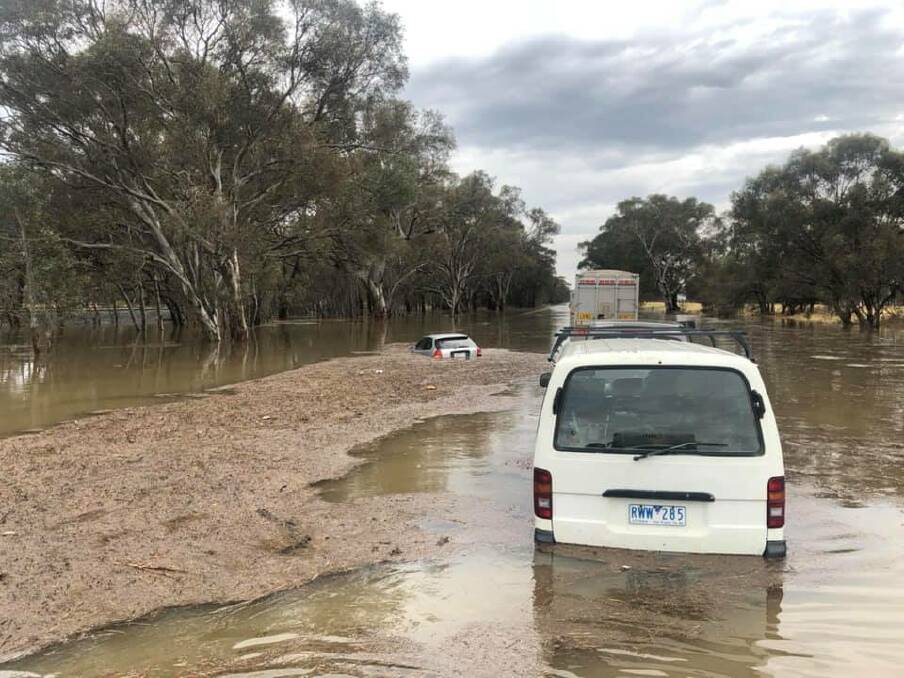 Hundreds stranded in floodwaters with major roads cut off