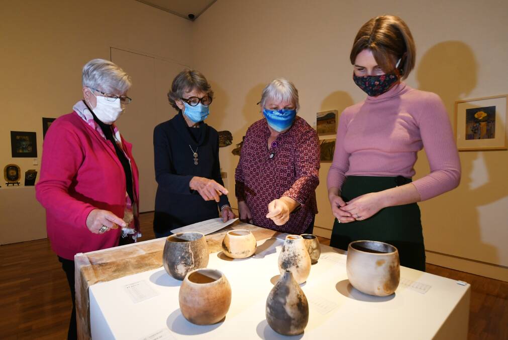 HELPING HANDS: Meg Larkin, Ruth Blakely, Pam Brown and Eloise Newell at Tamworth Regional Art Gallery. Photo: Gareth Gardner 
