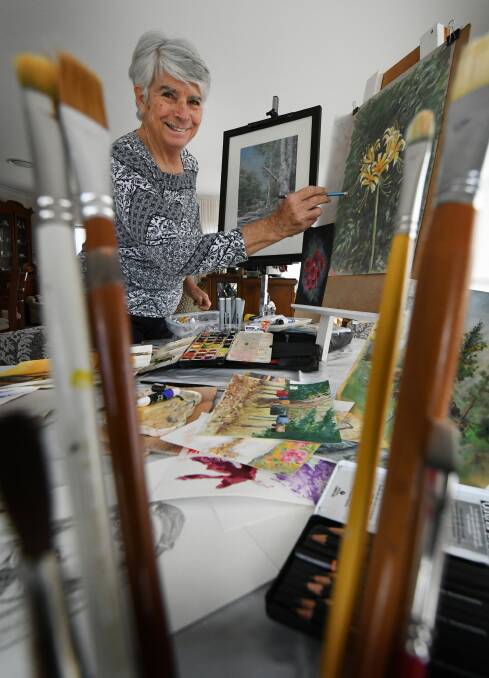 PAINT UP: Dorathy Wasson paints up a storm, ready for October's Kootingal arts competition. Photo: Gareth Gardner 
