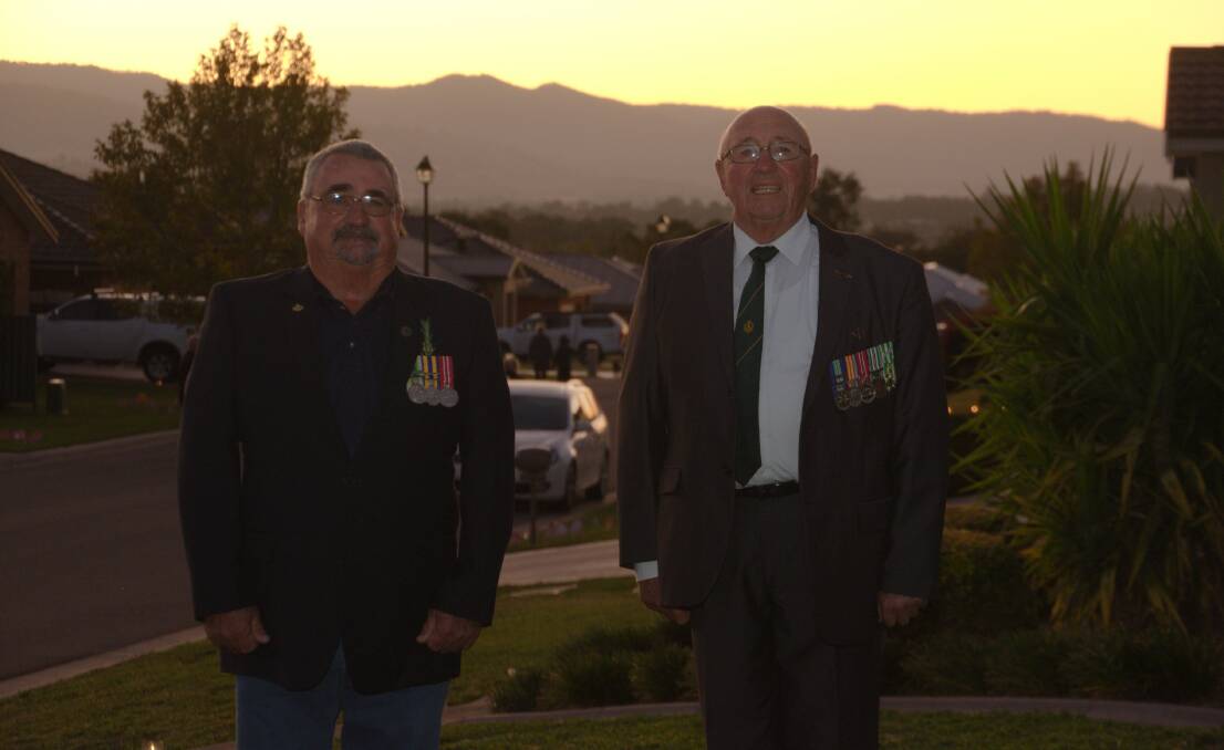 ANZACS: Navy man Bob Fisher with Cec Bayliss, from the army organised a "street" Anzac day dawn service in Tamworth. 