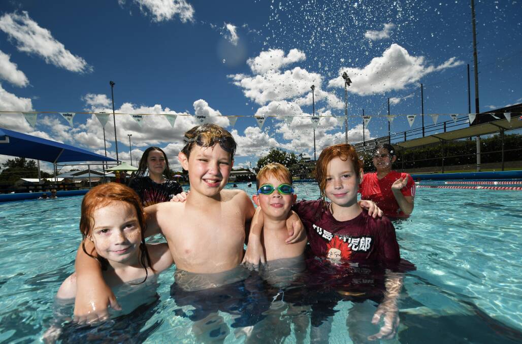 HOT STUFF: Tommy Cook 9, Jaiden Davis 11, Bentley Davis 9 and Billy Cook 9 are some of the few to hit the pool during a perfect Tamworth summer. Photo: Gareth Gardner