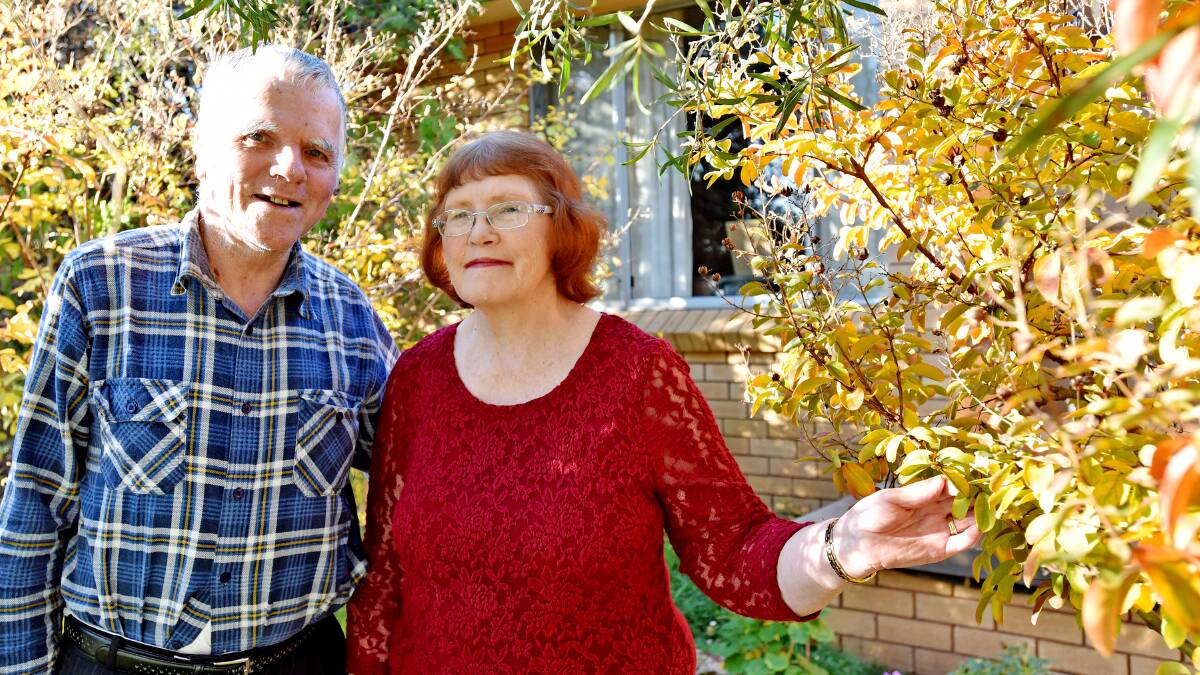 SMELLING THE ROSES: Eric Fowler, with wife Karen, spent more than 40 years advising the gardeners of Tamworth through his Tamworth Times column. Photo: Geoff O'Neill