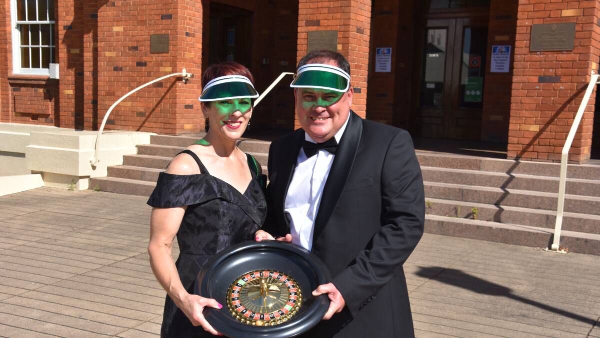 LICENCE TO THRILL: Rotary members Bryan and Helen Singh area already getting their black tie ready for the 007-themed May ball. Photo: Andrew Messenger