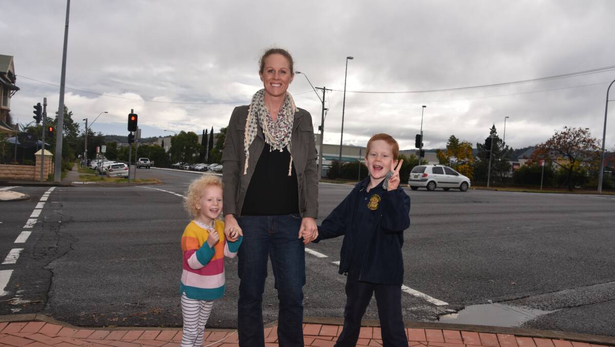 COMMUNITY WIN: Layla , Kylie and Ari Pollard celebrate a government commitment for an upgrade of the 'dangerous' Bridge Street pedestrian intersection. Photo: Andrew Messenger
