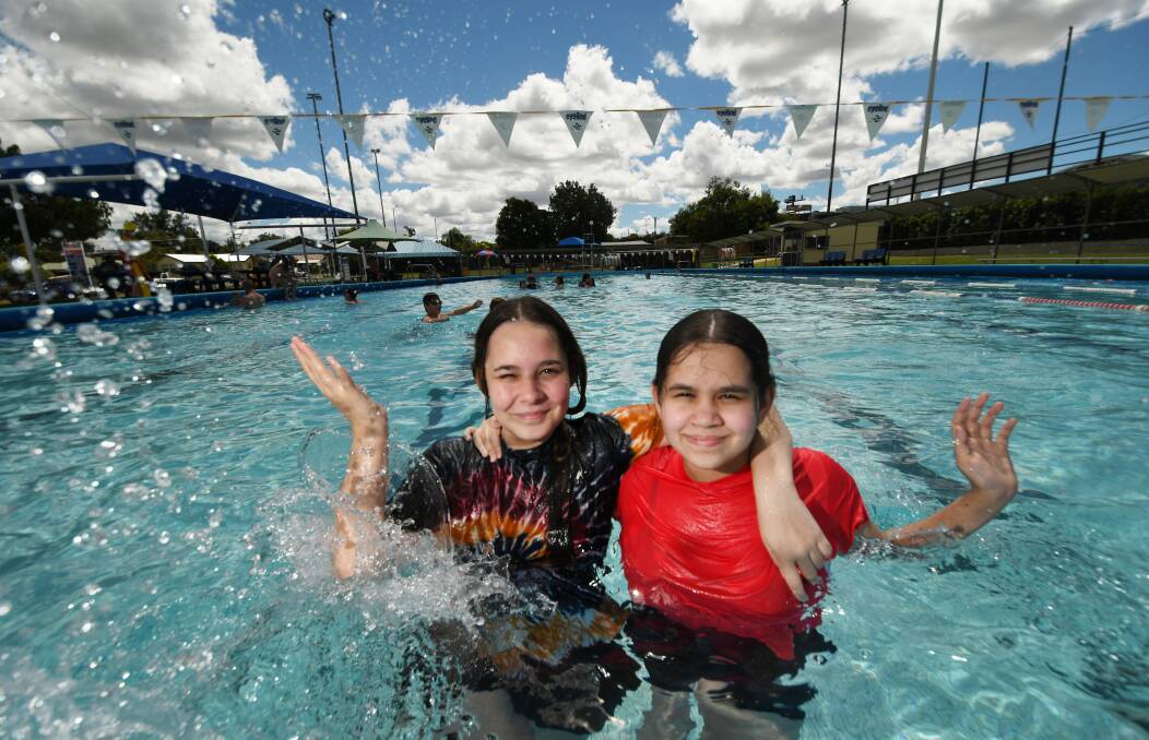 Eliza Cook 14 and Meleah Cook 16 at the South and West Tamworth War Memorial Swimming Pool at Scully Park. Photo: Gareth Gardner 