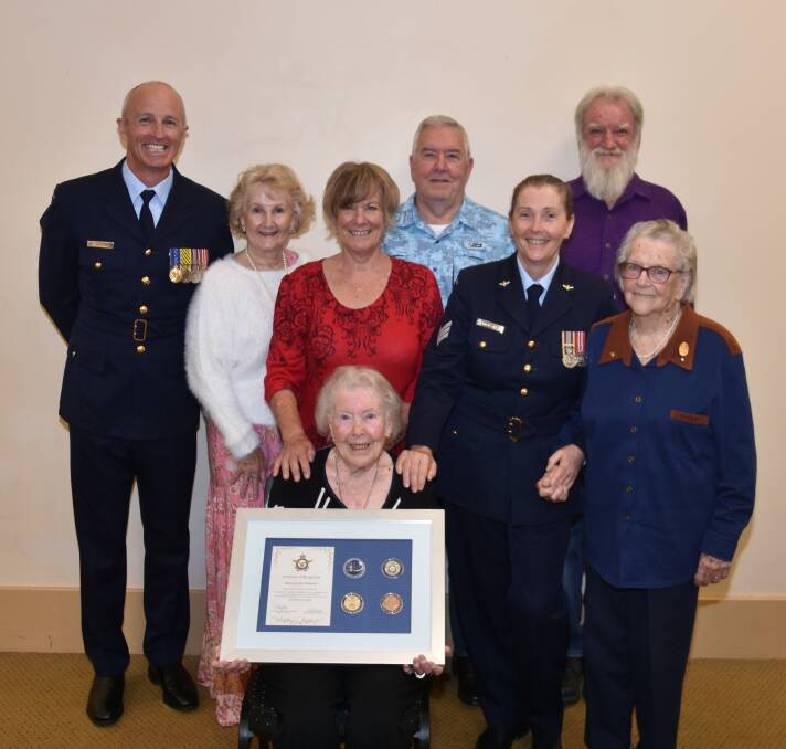 AWARDED: Acting sergeant Val Smith became one of just 130 Australians to receive the air forces' Chief of the Air Force's Centenary Coin, and the Warrant Officer of the Air Force's Coin marking them as 100-year-old air force veteran, on Friday. Photo: Andrew Messenger 