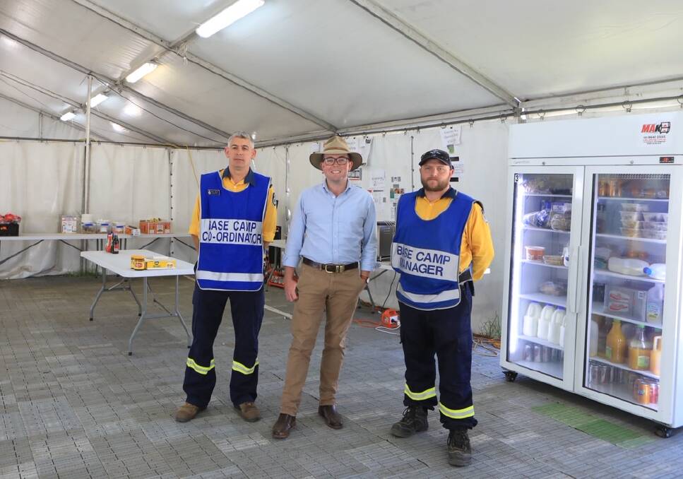 HOSPITALITY: Member for Northern Tablelands Adam Marshall (middle) toured the Glen Innes RFS tent city yesterday. He said he was "grateful" for the RFS' efforts.