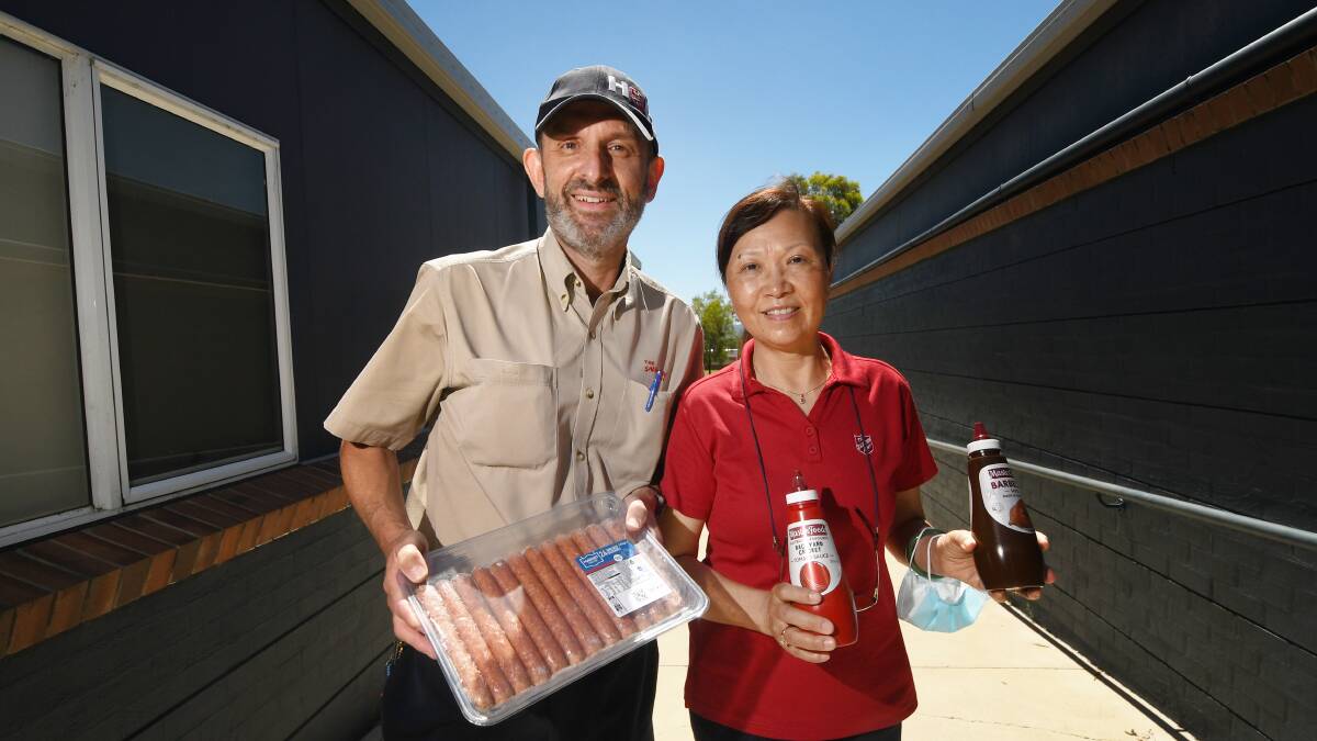 CHRISTMAS CELEBRATION: Majors Tony and Yan DeTommaso are going to throw a snag on the BBQ at a free community Christmas next week. Photo: Gareth Gardner 