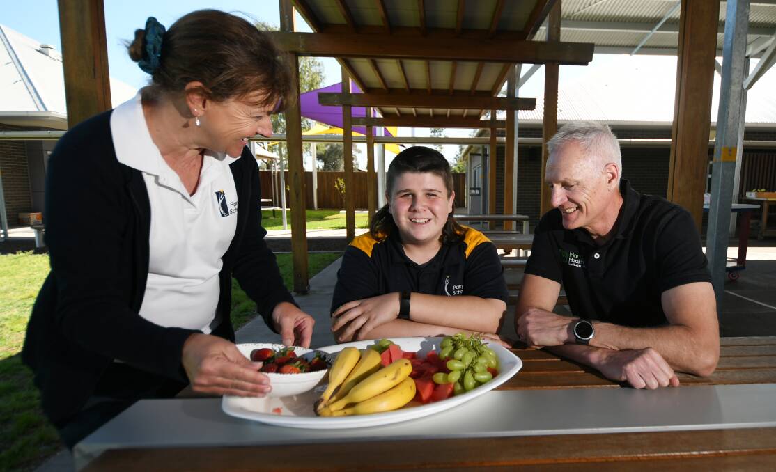 HEALTHY CHOICES: Parry School Principal Tina White with student Hayden White and Peter Annis-Brown, owner of Manage Health. Photo: Gareth Gardner