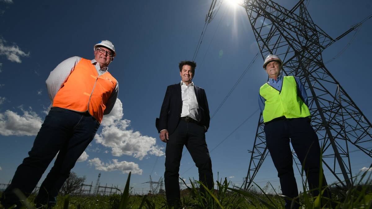 Power plan: TransGrid's John McCall and MP Kevin Anderson with Jason Gallan from Richard Crooke Constructions. Photo: Gareth Gardner