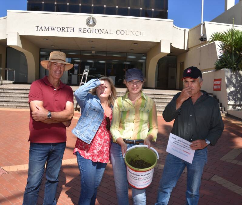 RAISE A STINK: Loomberah farmers Mark Gilbert, Kathy Gilbert, Carine Collison and Wayne Collison conducted a smelly protest against a feedlot scheme. Photo: Andrew Messenger