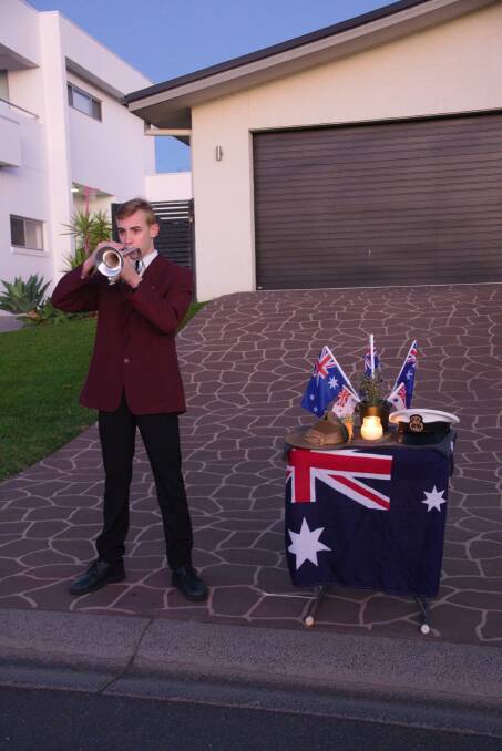 DAWN SERVICE: Jack Herden plays bugle at a community dawn service in Hillvue, Tamworth. Photo: Andrew Messenger. 