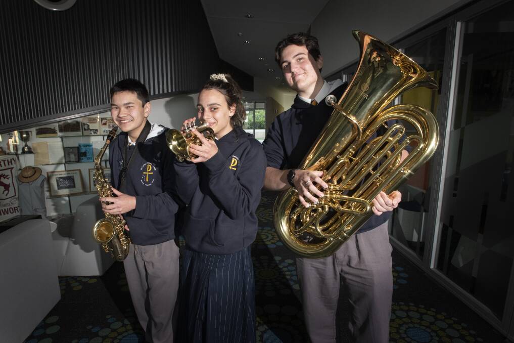 BLOWN AWAY: McCarthy students John Wong, Michelle Coats and Nicholas Hannan are set to stun exam markers at this year's trial HSC exams, which started Monday. Photo: Peter Hardin