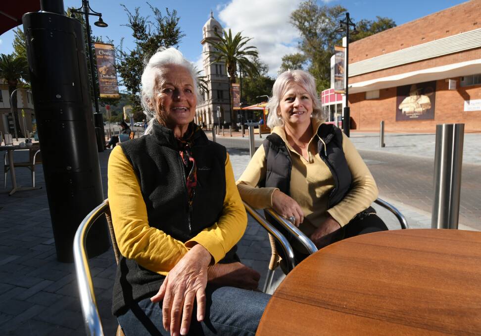 Friendly faces: Uralla friends Julie O'Halloran and Donna Bragg enjoyed their first cafe meal in weeks on Friday, but no coffee. Photo: Gareth Gardiner