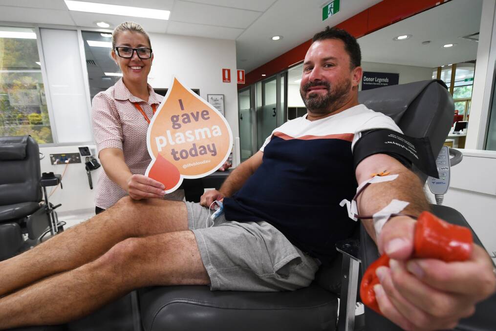 TAPPED OUT: Donor Services Nursing Assistant Janine Crowell takes blood from first-time donor Craig Smith. Photo: Gareth Gardner