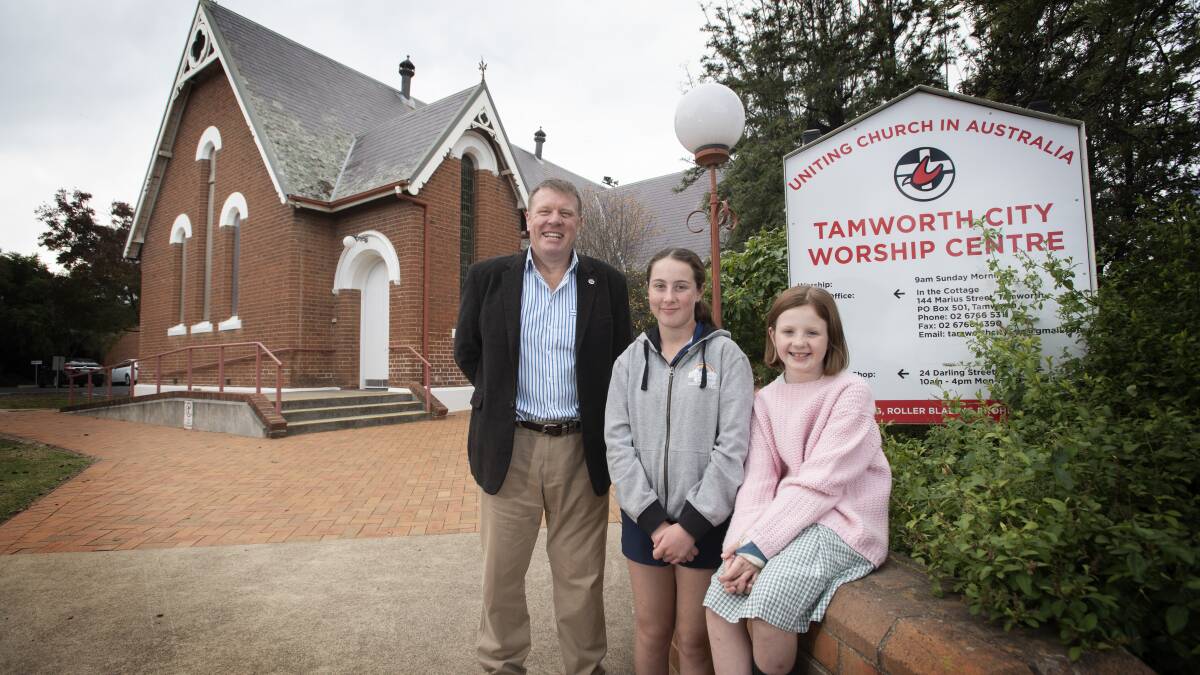 GREEN LIGHT: Reverend Simon Hansford is encouraging students like Lilly and Bella Dow to join a livestream tomorrow in lieu of the school's strike for climate. Photo: Peter Hardin 130520PHA015