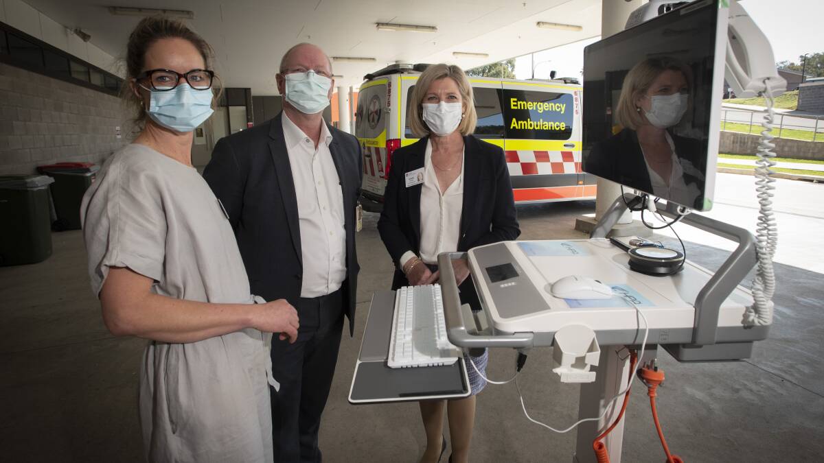 STROKE SERVICE: Rebecca Hosking, Dr James Hughes and Susan Heyman with the new ASAP tool. Photo: Peter Hardin 010921PHA010