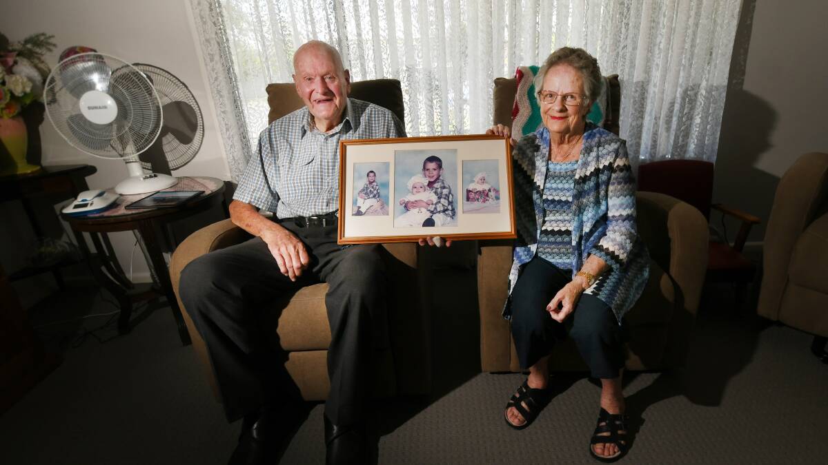 Proud grandparents John and Marie show off a baby photo of Tara (right) with brother Tim McClelland. Photo: Gareth Gardner