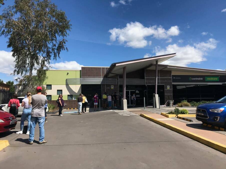 LONG LINE: The queue out the door of Tamworth's Centrelink was about an hour long on Tuesday, after long lines on Monday (pictured). 