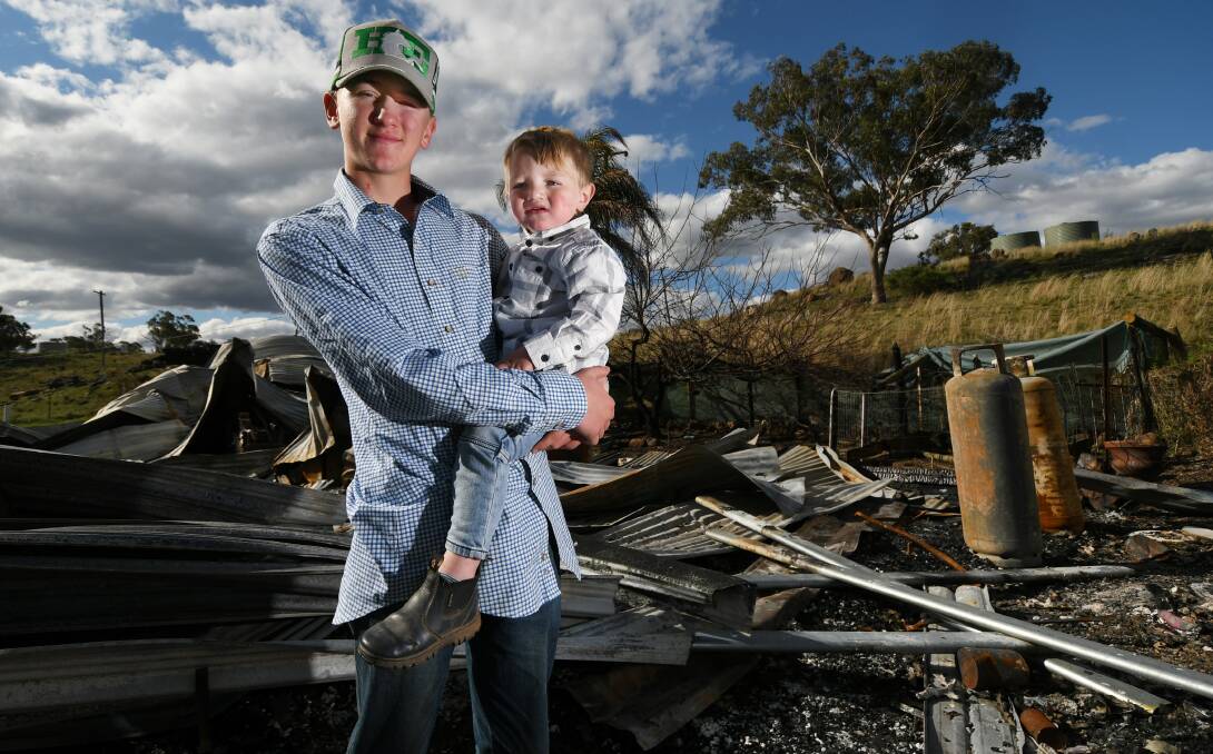 LIFE SAVER: Michael and Elijah Hirst at the scene of an avoided tragedy. The teenager saved his sleeping toddler brother from an intense housefire. Photo: Gareth Gardner 