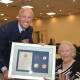 CENTENARIAN: RAAF acting sergeant Val Smith (right) receives an award commemoraing her 100th birthday from Flight Lieutenant Dave Slattery. Photo: Andrew Messenger 