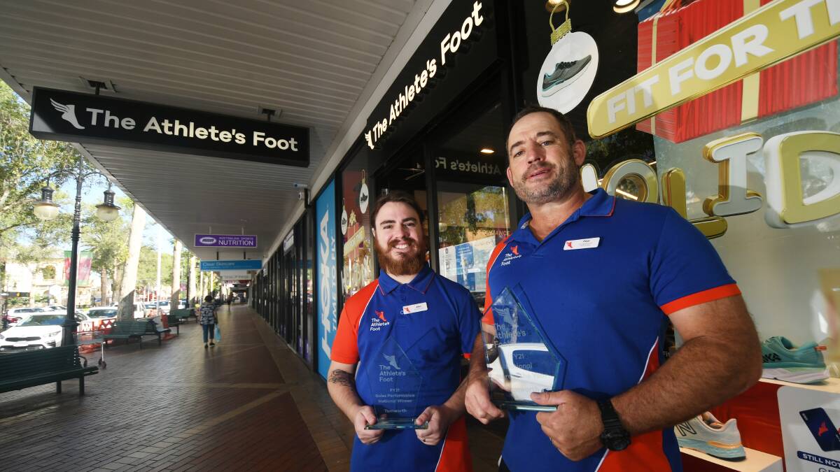 WINNERS: Allen Turner and Paul Lawrence from Tamworth's Athlete's Foot, which has been named Australian store of the year. Photo: Gareth Gardner