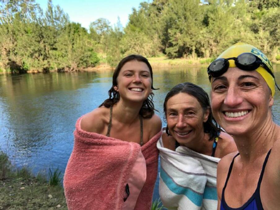 Cool dip: Burrell Creek Beauties Babette and Belinda Robertson with Liliana Kellett after a brisk swim in the Manning River. Photo supplied