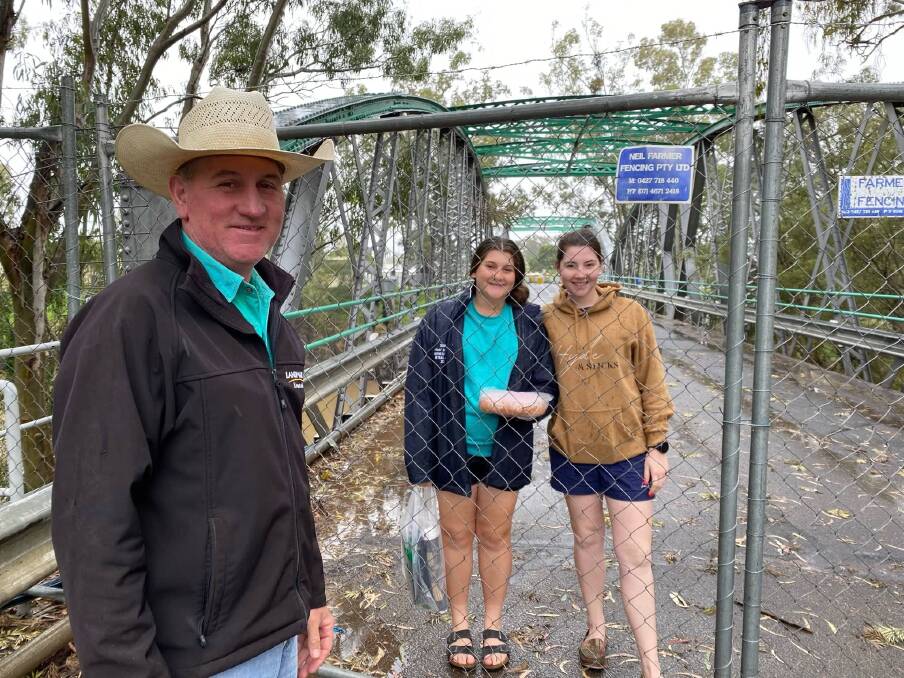 Still separated: Darren Smith celebrates Father's Day with daughters Jessica and Sophie from either side of the NSW/QLD border.