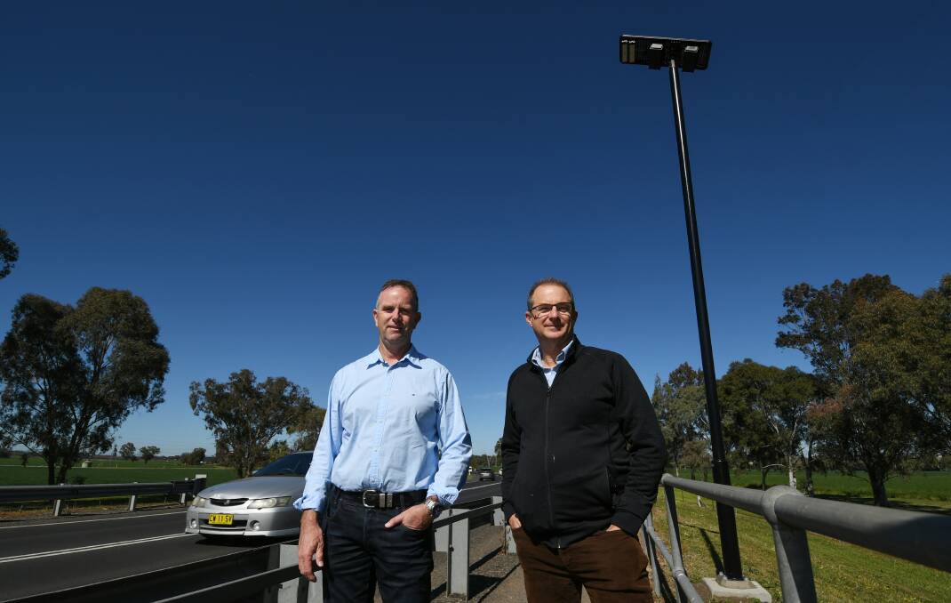 LIT UP: Tamworth councillor Mark Rodda and Tamworth Bicycle User Group president Greg Johnstone on the Scott Road footpath where the new lights have been installed. Photo: Gareth Gardner