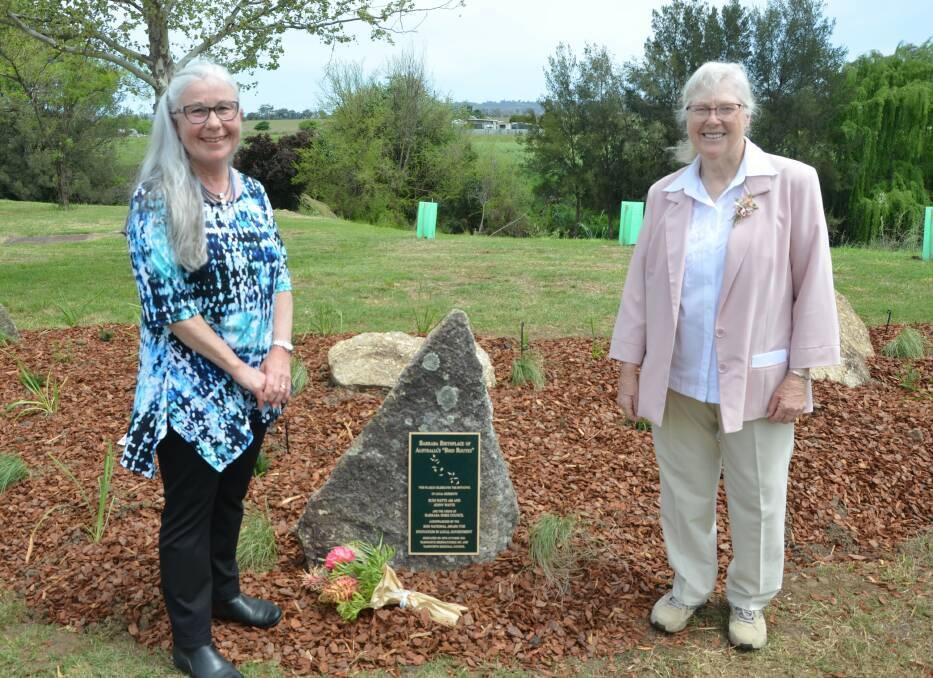 BIRDWATCHERS: Tamworth Birdwatchers' Denise Kane and president Jean Coady beside the memorial at Barraba's Bicentennial Riverbank Park. Photo: Caitlin Reid 