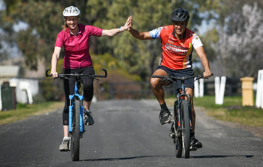 PEDAL POWER: Karen and Greg Vella have been using their collective pedal power to reach the rotary club's goal. Photo: Gareth Gardner 190821GGA01