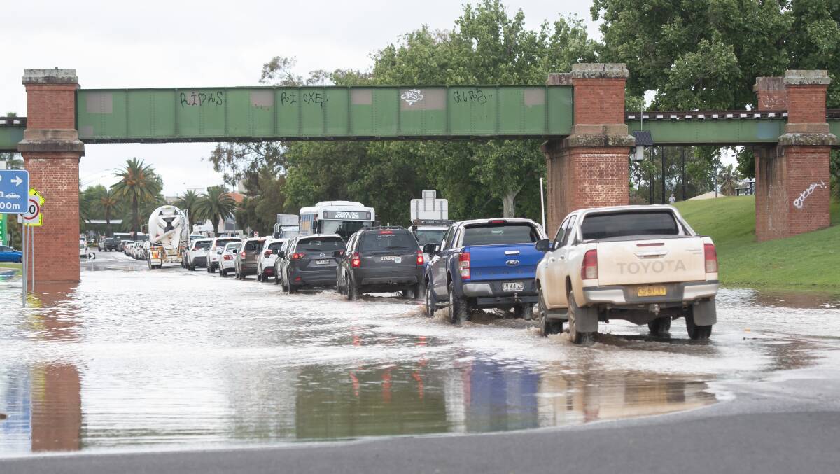 Traffic backed up on Peel Street in Tamworth on Tuesday morning as water pools near the viaduct at the bottom of O'Connell Street. Picture by Peter Hardin